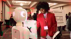 Dream_Makers_Summit_Student_Front_Of_Robot