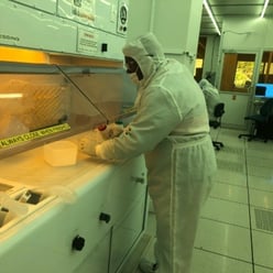 A M.O.R.E. Lab undergraduate researcher prepares samples at the solvent processing bench in the Georgia Tech IEN cleanroom.