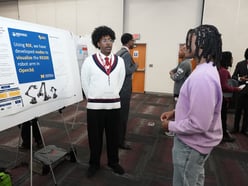 Student presenting during poster session