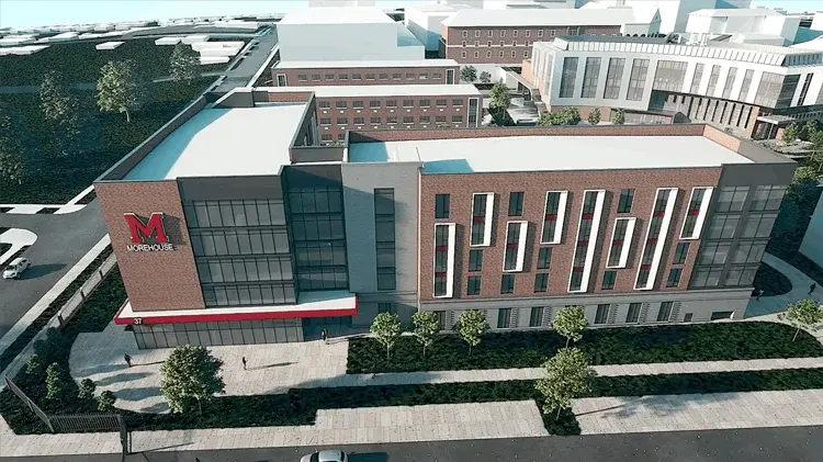 Aerial rendering of the new Morehouse residence hall with the maroon M mark on its facade